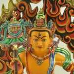 Gold Gilded, Multicolored 14" Yellow Dzambhala Sculpture with Snow Lion Mount, Hand Painted - Face Details