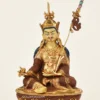 9.25-inch Guru Padmasambhava statue with 24K fire gilding, oxidized copper robes, blue hair, khatvanga with three impaled multicolored heads, kapala and lotus throne handcrafted in Nepal - gallery