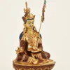 9.25-inch Guru Padmasambhava statue with 24K fire gilding, oxidized copper robes, blue hair, khatvanga with three impaled multicolored heads, kapala and lotus throne handcrafted in Nepal - right